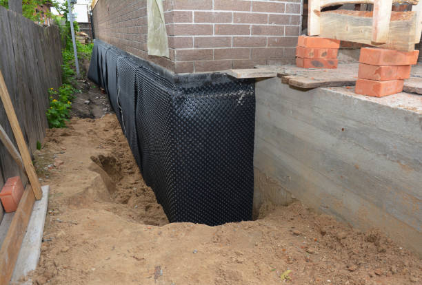 SJ Waterproofing Pros technician performing targeted Sump Pump Installation assessment in Columbia, KY